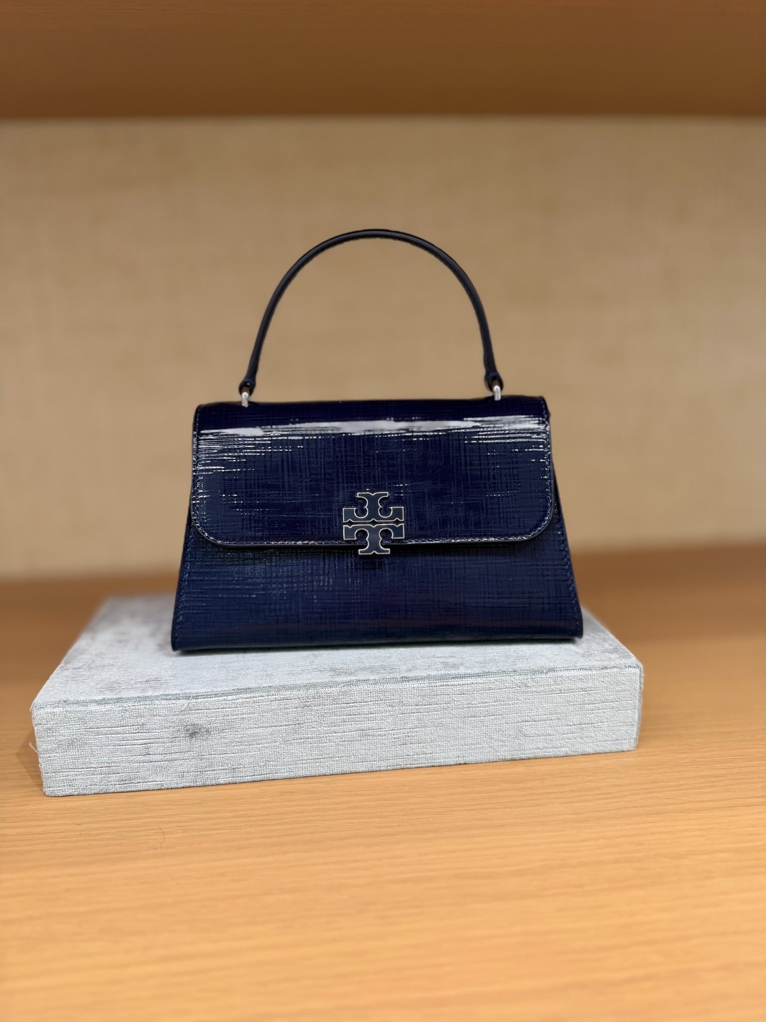 Britten Textured Patent Top Handle